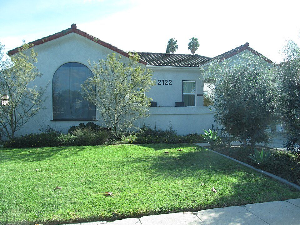 A white stucco house with a lawn in Los Angeles